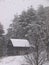 Mountain barn in snow