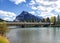 Mountain behind bridge and bow river in Alberta