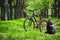 Mountain bike, backpack and helmet on a trail in the forest