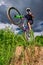 Mountain bike cyclist doing wheelie stunt on a mtb bike.