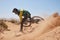 Mountain bike, dust and man cycling on dirt path for action, speed and travel adventure for sports fitness, exercise or