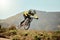 Mountain bike, man and action air jump and bicycle, challenge and adventure, freedom and fast race in nature. Cycling