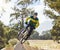 Mountain bike man, air ramp and outdoor with helmet, extreme sport and focus for fitness, speed and training. Bmx