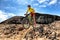 Mountain bike MTB biking man racing in mountain desert trail rocks path jumping in the air riding bicycle in mountains.