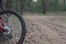 Mountain bike ready to go on a trail in the woods at sunrise