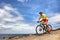 Mountain bike sport man riding MTB bicycle. Biking fitness athlete cyclist on mountain trail in summer outdoors. Sport health