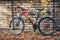 Mountain Bike Stands Near A Brick Wall, Front View. Holiday Weekend Activity