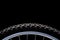 Mountain bike tire and rim on black