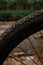 Mountain bike tires.  Wheels with mountain bike tires on grass and dirt background