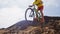 Mountain biker biking on MTB bike cycling trail