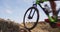 Mountain biker biking in slow motion on MTB mountain biking trail