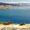 Mountain biker celebrating inspiring view at the sea