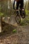 Mountain Biker Drops In To Jumps