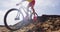 Mountain biker jumping in slow motion on MTB mountain biking trail