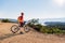 Mountain biker looking at the sea view