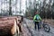 Mountain biker riding cycling in wet autumn forest