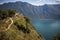 Mountain Biker riding on a narrow trail above lake Garda