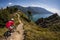 Mountain Biker riding on a narrow trail above Lake Garda