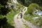 Mountain biker on rural road in mountain