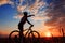 Mountain biker silhouette in sunrise