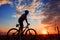 Mountain biker silhouette in sunrise