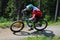 Mountain biker speeding downhill in the forest of the Harz mountains, Germany.