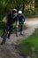 Mountain biker speeding downhill on a mountain bike track in the woods