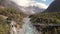 Mountain bikers crossing a swinging bridge in Nepal.