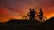 Mountain bikers outdoors riding at sunset