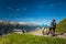 Mountain bikers riding enduro trail in the alps