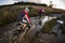 Mountain bikers riding through flooded road