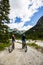 Mountain biking couple with bikes on track, Cortina d`Ampezzo, D