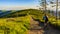 Mountain biking cycling at sunset in summer mountains forest lan