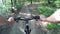 Mountain biking in a forest. POV original point of view