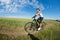 Mountain biking happy sportive girl relax in meadows sunny countryside