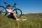 Mountain biking happy sportive girl relax in meadows sunny countryside