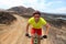 Mountain biking MTB bike man riding bicycle on dirt road in mountain trail outdoor. Sport fitness man in helmet, sunglasses,