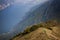 Mountain Biking on a narrow trail above a lake