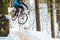 Mountain biking in snowy forest