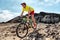 Mountain biking sports athlete man riding MTB bike fast in trail. Man pedaling and bicycle