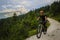 Mountain biking woman in Dolomites, Italy