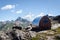 Mountain bivouac free sleeping shelter in the piedmontese alps Italy, facing the Mount Viso