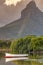 Mountain and boat in the river mouth