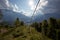 Mountain cableway stretching down over beautiful early autumn mountain landscape.