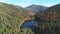 Mountain calm blue lake among forestry hills in highland