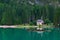 A mountain church reflected in the water of Lake Braies