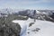 Mountain Climber Heading Across Snow For Distant Peak