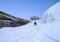 Mountain climber heading up a steep hanging glaicer around seracs in the Alps of Switzerland