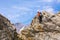 Mountain Climber on rocky ridge with rope and safety gear