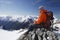 Mountain Climber Using Laptop On Mountain Peak